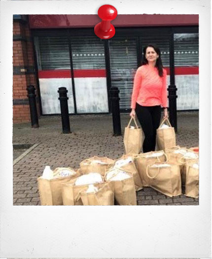 Goodwin Barrett team handing out food bags for Urban Outreach Bolton