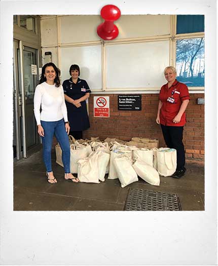Goodwin Barrett MD Michelle Barrett with bags of baby essentials donated to Royal Bolton Hospital Maternity Unit